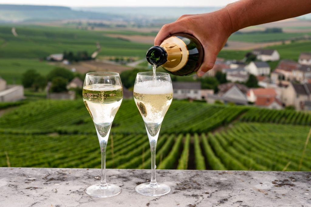Landscape in Champagne, with 2 glass of sparkling wine in the foreground